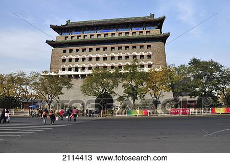 Stock Image - Pedestrians Crossing A Street Towards A Building; Beijing China. Fotosearch