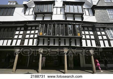 Stock Image - Pedestrians in a retail area; Dartmouth, Devon, England. Fotosearch