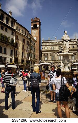 Stock Photograph - Pedestrians in the town square; Verona, Italy. Fotosearch