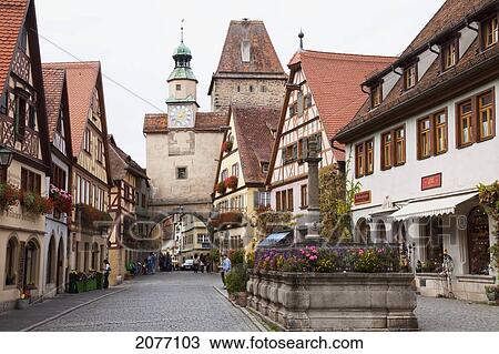 Pedestrians On A Street With A Clock Tower And Archway; Rothenburg Ob Der Tauber Bavaria Germany View Large Photo Image Stock Image - Pedestrians On A Street With A Clock Tower And Archway; Rothenburg Ob Der Tauber Bavaria Germany. Fotosearch