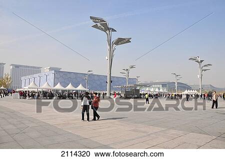 Pedestrians On A Walkway In An Urban Area With Unique Light Posts; Beijing China View Large Photo Image Stock Image - Pedestrians On A Walkway In An Urban Area With Unique Light Posts; Beijing China. Fotosearch
