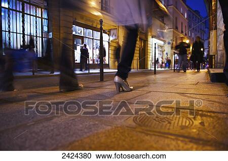 Pedestrians on a walkway outside retail shops; Paris, France View Large Photo Image Stock Image - Pedestrians on a walkway outside retail shops; Paris, France. Fotosearch