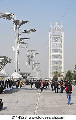 Stock Image - Pedestrians On A Walkway With Unique Architecture Built For The Summer Olympics; Beijing China. Fotosearch