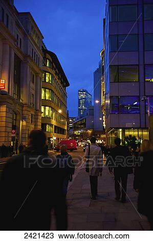Pedestrians walking at dusk in the city centre; London, England View Large Photo Image Stock Image - Pedestrians walking at dusk in the city centre; London, England. Fotosearch