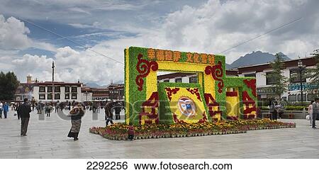 Stock Photograph - Pedestrians walking in city square; Lhasa, Xizang, China. Fotosearch