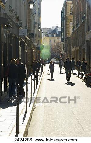 Pedestrians walking in Marais district; Paris, France View Large Photo Image Stock Photograph - Pedestrians walking in Marais district; Paris, France. Fotosearch