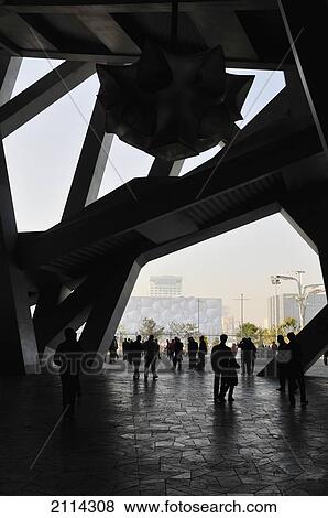 Stock Photo - Pedestrians Walking On A Path In The Bird's Nest Stadium; Beijing China. Fotosearch