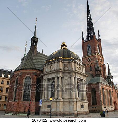 Pedestrians Walking On The Street By A Church Building; Stockholm Sweden View Large Photo Image Stock Image - Pedestrians Walking On The Street By A Church Building; Stockholm Sweden. Fotosearch