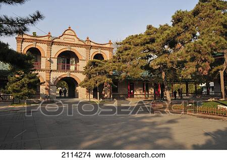 Pedestrians Walking Through An Archway In A Gate Along A Pathway In An Urban Area; Beijing China View Large Photo Image Picture - Pedestrians Walking Through An Archway In A Gate Along A Pathway In An Urban Area; Beijing China. Fotosearch