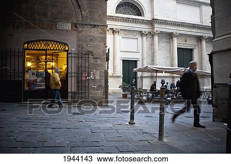 Stock Image - Pedestrians Walking Through The Streets; Genoa Liguria Italy. Fotosearch