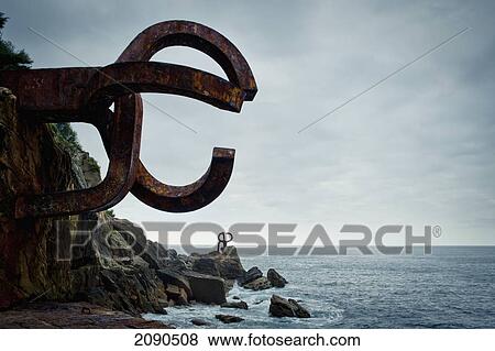 Stock Photo - Peine Del Viento, Eduardo Chillida's Sculpture In Ondarreta Beach, San Sebastian, Basque Country, Spain. Fotosearch