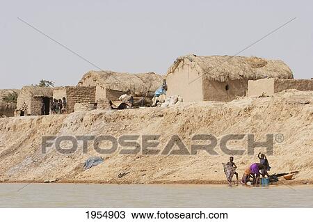 Stock Image - People along the shores of the Niger River between Mopti and Lake Debo, Mali. Fotosearch