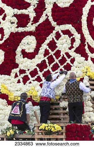 People Arranging Carnation Flowers On Flower Robe Of Virgin De Los Desamparados (Holy Virgin Of The Lonely And Homeless) During Fallas Festival; Valencia, Spain View Large Photo Image Stock Image - People Arranging Carnation Flowers On Flower Robe Of Virgin De Los Desamparados (Holy Virgin Of The Lonely And Homeless) During Fallas Festival; Valencia, Spain. Fotosearch