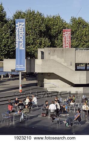 Stock Image - People At Cafe Outside National Theatre, London, England. Fotosearch