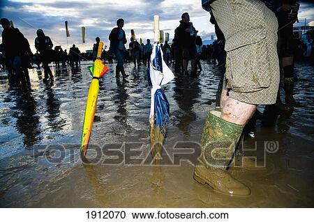 Stock Image - People At Glastonbury Festival, Somerset, Uk. Fotosearch