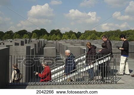 Stock Photograph - People At The Entrance To The Underground Information Centre At The Memorial To The Murdered Jews Of Europe; E, Berlin, Germany. Fotosearch