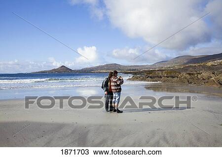 Stock Image - People At White Strand Beach; Castlecove, County Kerry, Ireland. Fotosearch