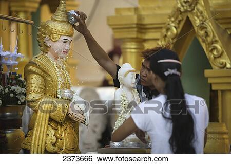 People bathing or splashing a Buddha statue in Shwedagon Pagoda; Yangon, Burma View Large Photo Image Stock Photograph - People bathing or splashing a Buddha statue in Shwedagon Pagoda; Yangon, Burma. Fotosearch
