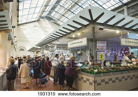 Stock Photography - People buying fresh produce from a market in France, The markets of Rochefort. Charente-Maritime department of the Poitou-Charentes region of France. PHOTO. Fotosearch