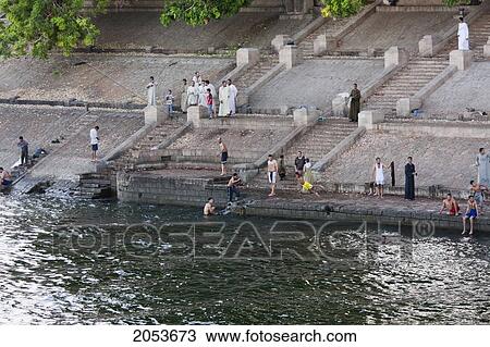 Stock Image - People By The Shores Of The Nile River Between Luxor And Esna, Qina, Egypt. Fotosearch