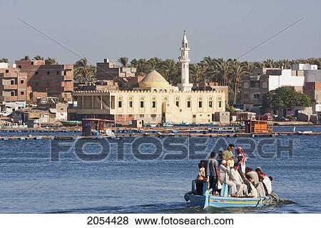 People Crossing The Rosetta Branch Of The Nile River In A Boat And Mosque On The Shores Of The Rosetta Branch Of The Nile River, Rosetta (Rashid), Beheira, Egypt View Large Photo Image Stock Photo - People Crossing The Rosetta Branch Of The Nile River In A Boat And Mosque On The Shores Of The Rosetta Branch Of The Nile River, Rosetta (Rashid), Beheira, Egypt. Fotosearch