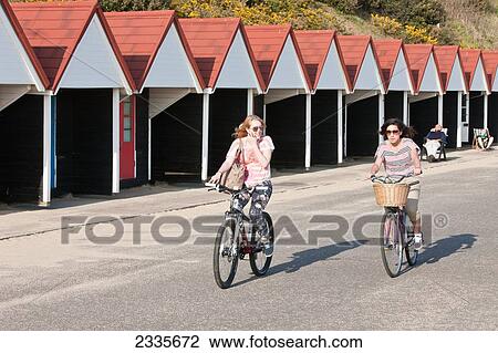 People Cycling Past Sun-Bathers At Bournemouth Beach; Bournemouth, Dorset, England, Uk View Large Photo Image Stock Image - People Cycling Past Sun-Bathers At Bournemouth Beach; Bournemouth, Dorset, England, Uk. Fotosearch