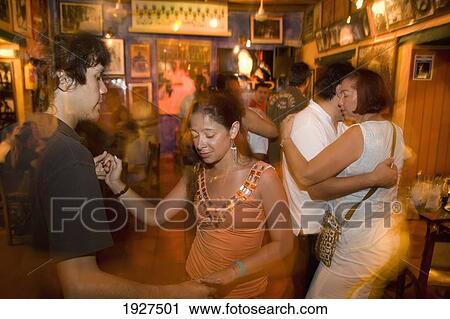 Stock Image - People Dancing Salsa In Quiebra Canto. Fotosearch