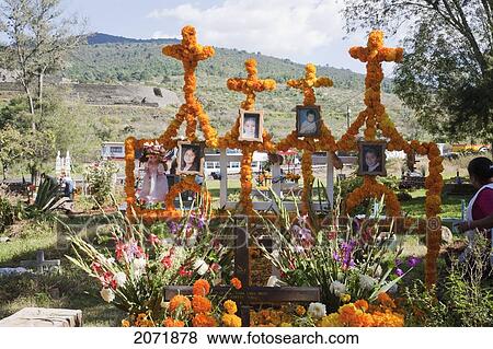 People Decorate The Grave Of Four Children Who Died In A House Fire For The Celebration Of D View Large Photo Image Stock Photo - People Decorate The Grave Of Four Children Who Died In A House Fire For The Celebration Of D. Fotosearch