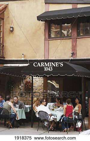 Stock Photography - People Dining At Outdoor Tables At Carmines Restaurant On Rush Street, Chicago, Illinois, Usa. Fotosearch