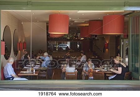 People dining in restaurant View Large Photo Image Picture - People dining in restaurant. Fotosearch