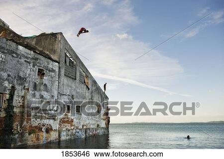 People Diving Off Cliff; Bahia, Brazil View Large Photo Image Stock Photograph - People Diving Off Cliff; Bahia, Brazil. Fotosearch