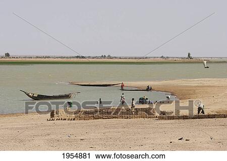 People doing laundry in the Niger River at Sebi, Mali View Large Photo Image Stock Image - People doing laundry in the Niger River at Sebi, Mali. Fotosearch