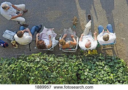 Stock Photo - People Drinking Outside Watching A Concert, Aerial View. Fotosearch