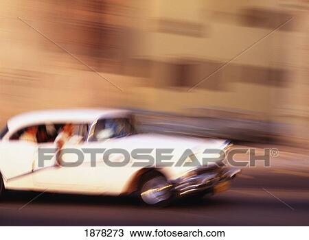 People Driving A Classic American Car In Havana, Blurred Motion View Large Photo Image Stock Image - People Driving A Classic American Car In Havana, Blurred Motion. Fotosearch