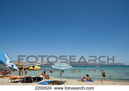 People Enjoying The Summer In Cala Sant Pere, Alcudia, Mallorca, Balearic Islands, Spain View Large Photo Image Picture - People Enjoying The Summer In Cala Sant Pere, Alcudia, Mallorca, Balearic Islands, Spain. Fotosearch