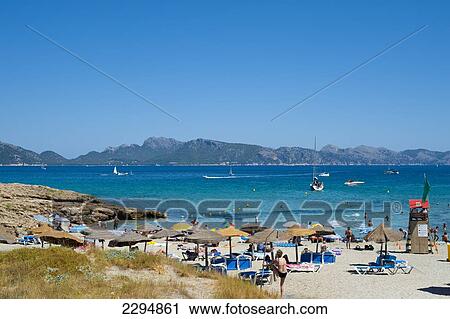 People Enjoying The Summer In Cala Sant Pere, Alcudia, Mallorca, Balearic Islands, Spain View Large Photo Image Stock Image - People Enjoying The Summer In Cala Sant Pere, Alcudia, Mallorca, Balearic Islands, Spain. Fotosearch