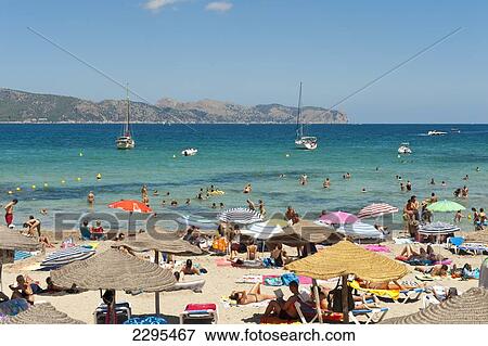 People Enjoying The Summer In Cala Sant Pere, Alcudia, Mallorca, Balearic Islands, Spain View Large Photo Image Stock Photo - People Enjoying The Summer In Cala Sant Pere, Alcudia, Mallorca, Balearic Islands, Spain. Fotosearch