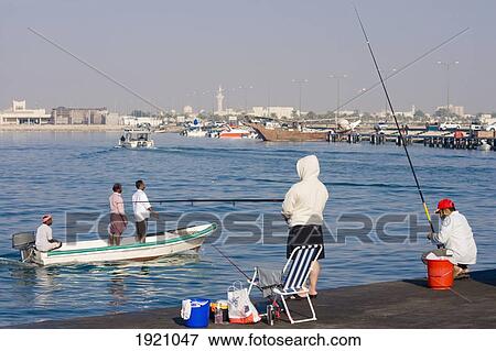 Stock Photo - People Fishing At Al Wakrah Port, Qatar. Fotosearch