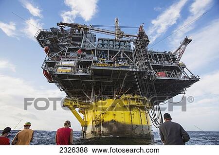 People fishing off boat beside perdido oil rig; Corpus christi texas usa View Large Photo Image Stock Photo - People fishing off boat beside perdido oil rig; Corpus christi texas usa. Fotosearch