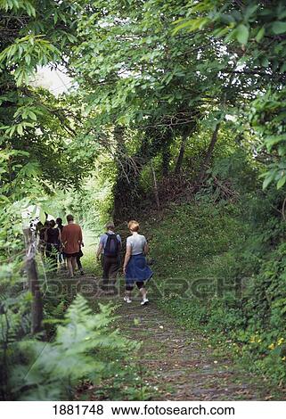 Stock Photo - People Hiking In Countryside. Fotosearch