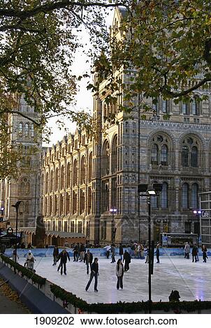 Stock Image - People Ice Skating By Natural History Museum, London, England, Uk. Fotosearch