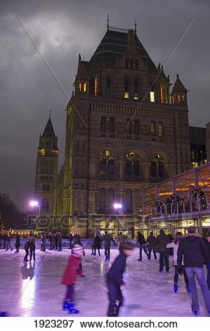 Stock Photo - People Ice Skating Outside Natural History Museum, London, England. Fotosearch