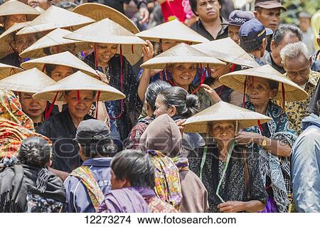People in a formal funeral procession called MaÆpassa Tedong at a rante, the ceremonial site for a Torajan funeral, in Sereale, Toraja Land, South Sulawesi, Indonesia View Large Photo Image Picture - People in a formal funeral procession called MaÆpassa Tedong at a rante, the ceremonial site for a Torajan funeral, in Sereale, Toraja Land, South Sulawesi, Indonesia. Fotosearch