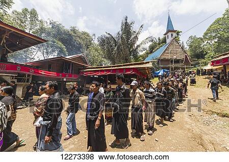 People in a formal funeral procession called MaÆpassa Tedong at a rante, the ceremonial site for a Torajan funeral, in Sereale, Toraja Land, South Sulawesi, Indonesia View Large Photo Image Stock Photo - People in a formal funeral procession called MaÆpassa Tedong at a rante, the ceremonial site for a Torajan funeral, in Sereale, Toraja Land, South Sulawesi, Indonesia. Fotosearch