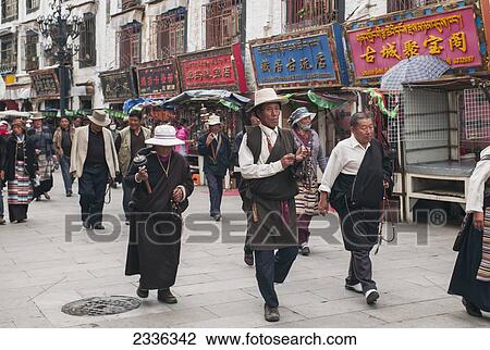 People In A Parade Walking Down A Street; Tibet, China View Large Photo Image Stock Image - People In A Parade Walking Down A Street; Tibet, China. Fotosearch