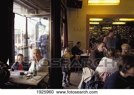 Stock Image - People In Cafe; Reykjavik, Iceland. Fotosearch