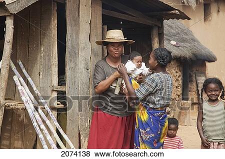 People In Front Of A Sugar Cane Shop, Ambalavao, Fianarantsoa Province, Madagascar View Large Photo Image Stock Photo - People In Front Of A Sugar Cane Shop, Ambalavao, Fianarantsoa Province, Madagascar. Fotosearch