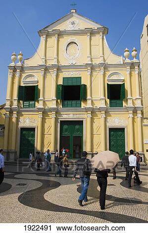 Stock Image - People In Front Of St Dominics Church. Fotosearch
