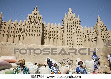 Stock Photograph - People In Front Of The Grand Mosque In Djenne, Mali. Fotosearch