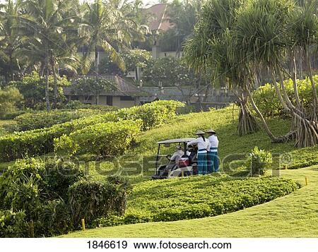 Stock Photo - People In Golf Cart On Golf Course. Fotosearch